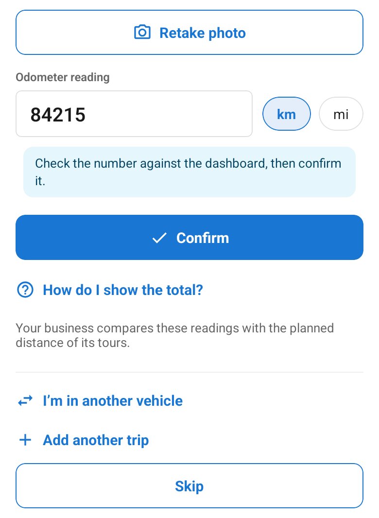 The odometer screen after the photo: check the number, then confirm it.